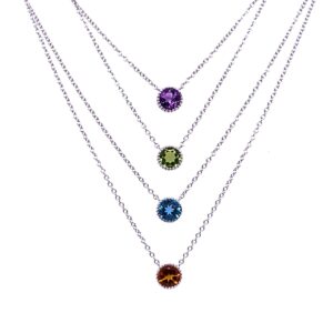 silver and gemstone necklace with beaded bezel